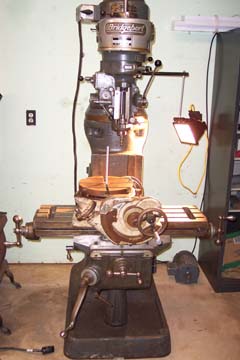 The Bridgeport mill setup with a worklight and rotary table