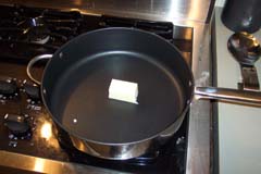 Put about 1/3 stick of butter in the pan and heat